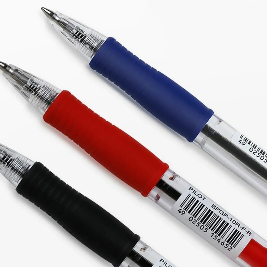 Three pens with red, blue, and black grips on a white background