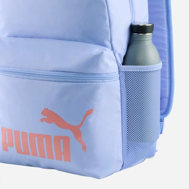Light blue Puma backpack with a water bottle in the pocket on a white background