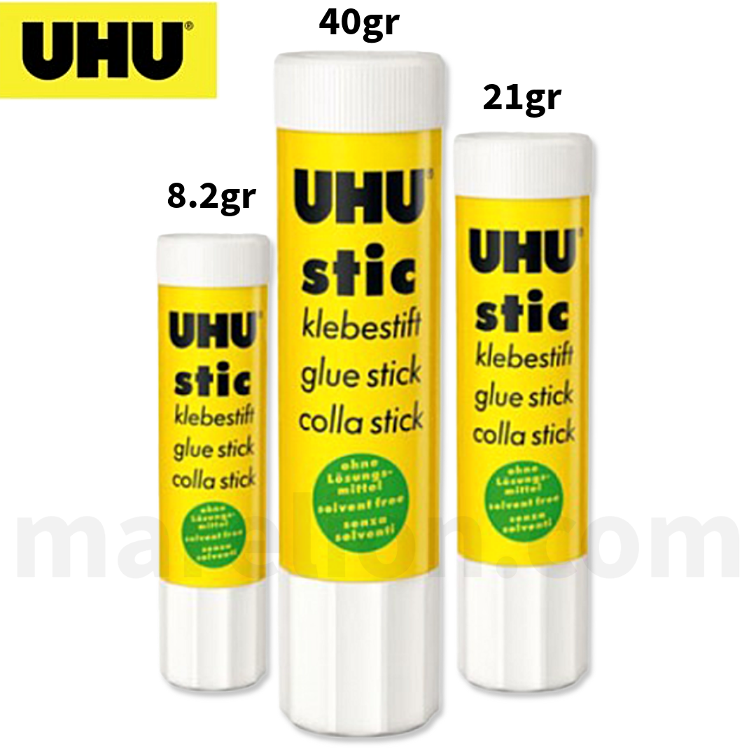 Three UHU glue sticks of different sizes on a white background