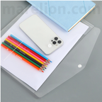 Clear phone case with smartphone, colorful pencils, and notebook on a gray surface