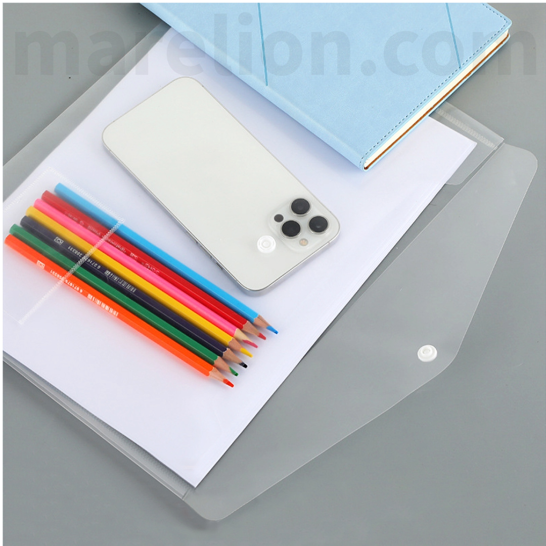 Clear phone case with smartphone, colorful pencils, and notebook on a gray surface